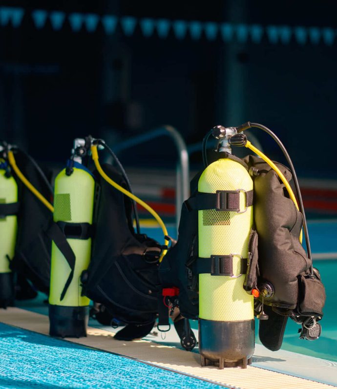 three-oxygen-tanks-at-poolside-diving-equipment-2021-09-18-05-51-48-utc
